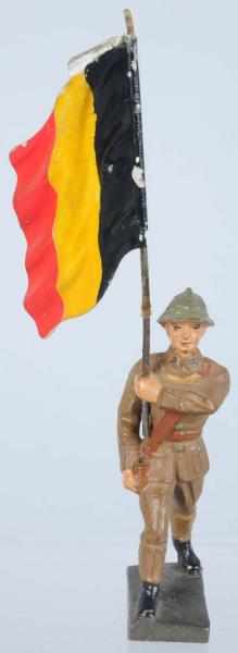 Appraisal: Lineol cm Belgian Flagman Tin flag with composition man Condition