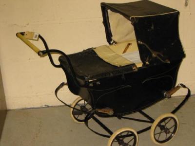 Appraisal: A doll's pram by Swallow with painted and lined wood