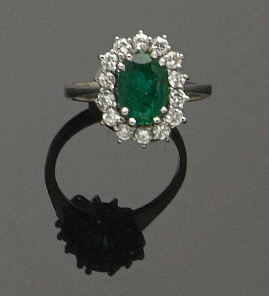 Appraisal: An emerald diamond and karat white gold ring centering one