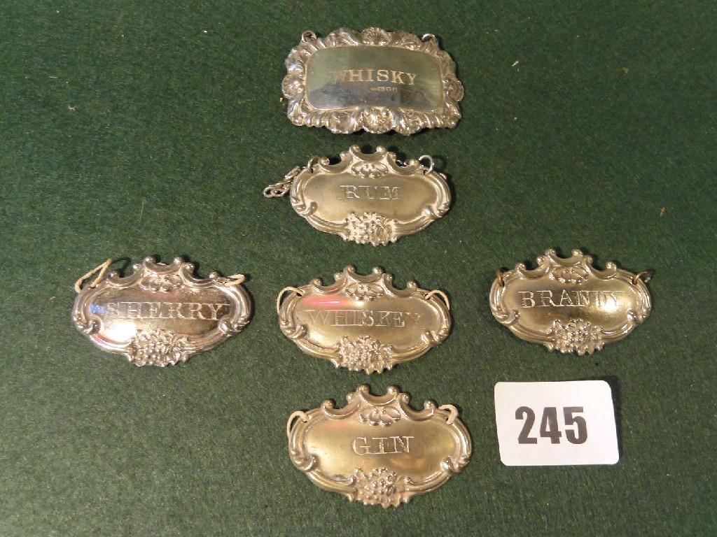 Appraisal: A small collection of various silver and plated decanter labels