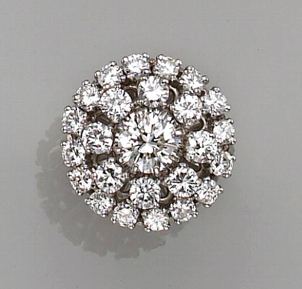 Appraisal: centering a round brilliant-cut diamond surrounded by two rows of