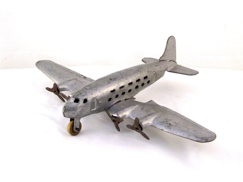 Appraisal: Pressed Steel Airplane Pressed steel construction with original silver paint