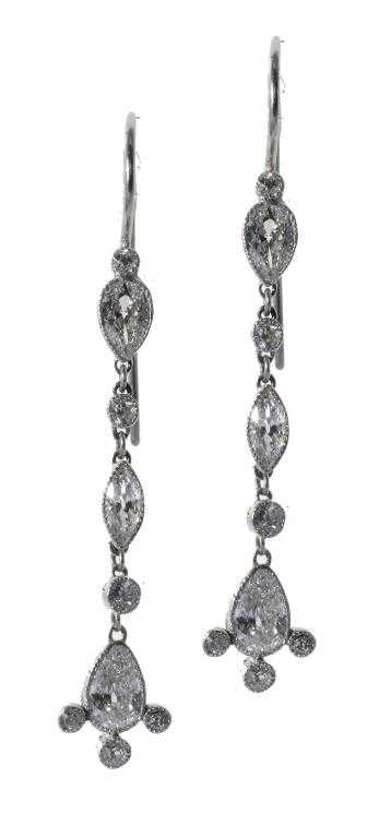 Appraisal: A PAIR OF DIAMOND EARRINGS of larger pear and navette