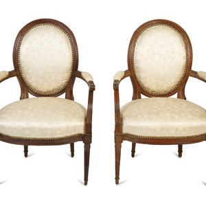 Appraisal: A Pair of Louis XVI Walnut Fauteuils en Cabriolet LAST