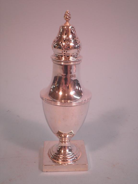 Appraisal: A silver baluster shaped sugar castor the flame finial and