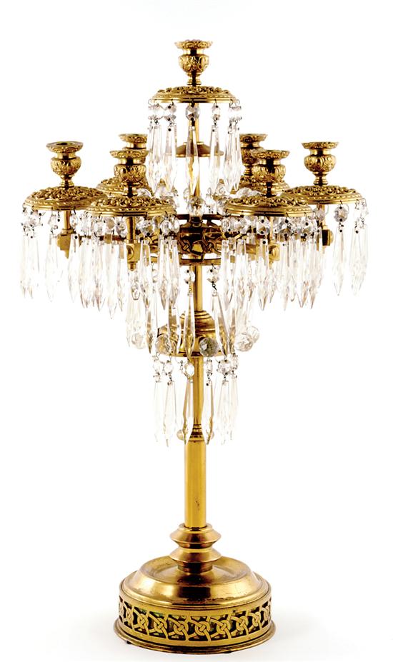 Appraisal: Brass and crystal seven-light candelabrum circa turned stem supporting seven