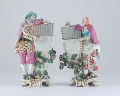 Appraisal: A pair of Chelsea sweetmeat figures modelled as bun-sellers each