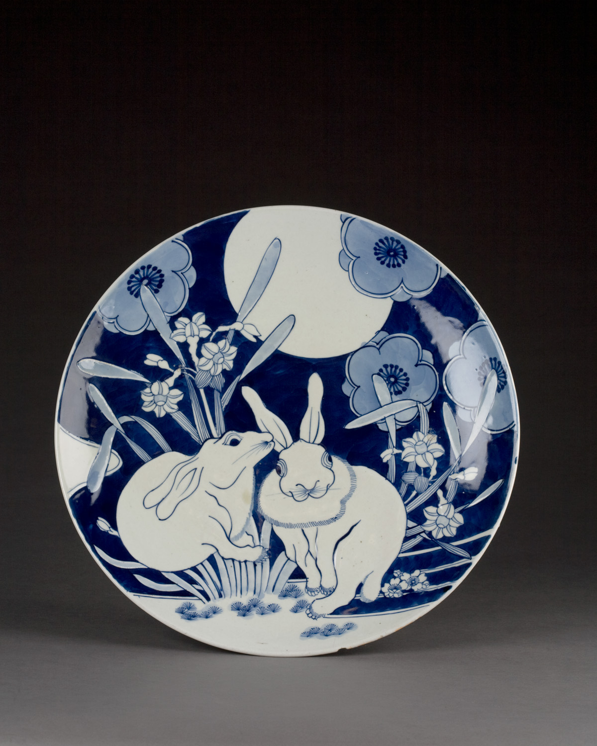 Appraisal: LARGE JAPANESE BLUE AND WHITE CHARGER WITH MOLDED DECORATION OF