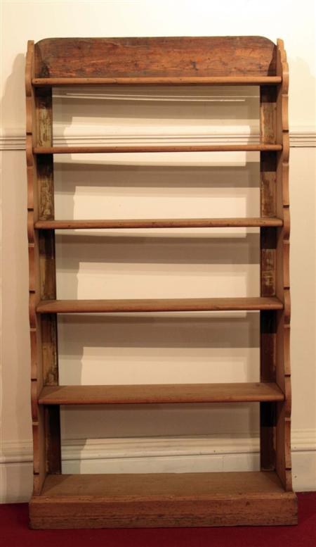 Appraisal: A Victorian pine waterfall bookcase the moulded top above six