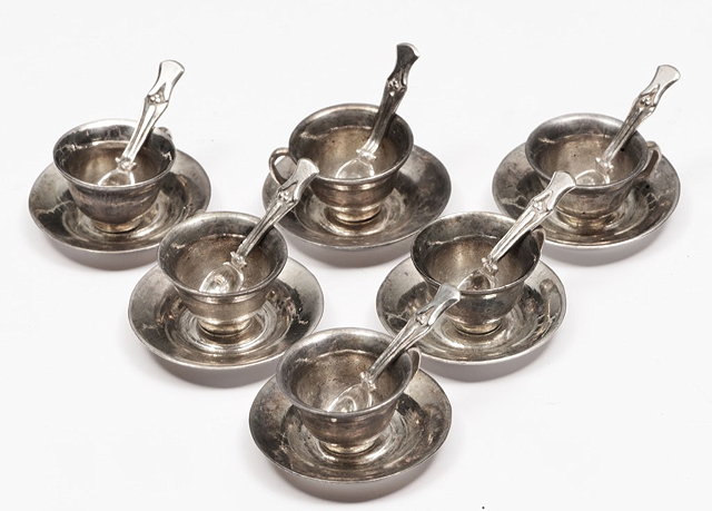 Appraisal: A MINIATURE TEA SET comprising six cups saucers and spoons