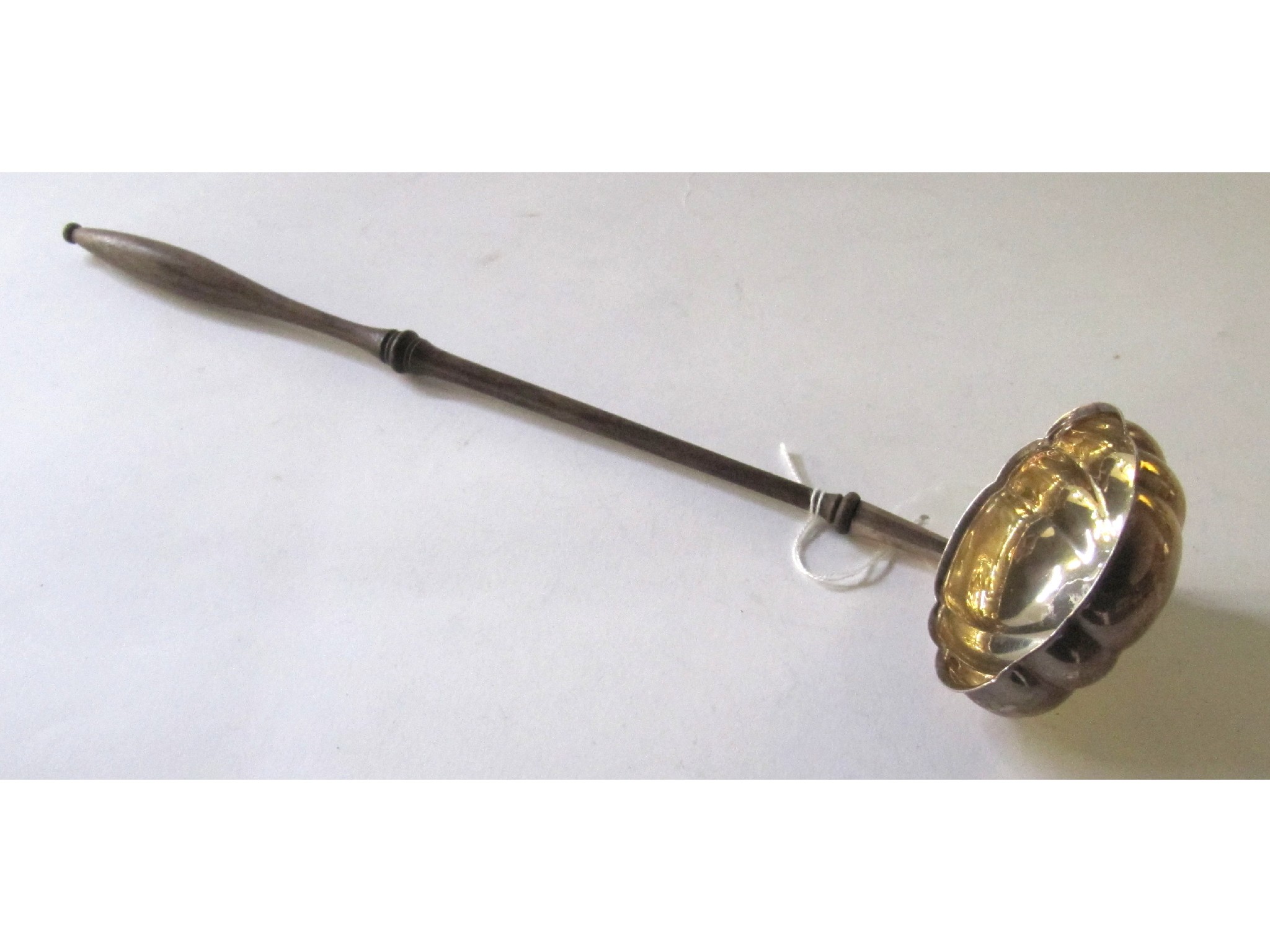 Appraisal: A silver bowled toddy ladle London