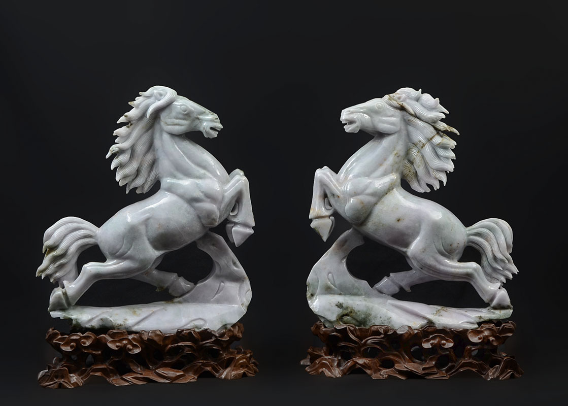 Appraisal: PAIR CHINESE CARVED JADEITE REARING HORSES Apple green and light