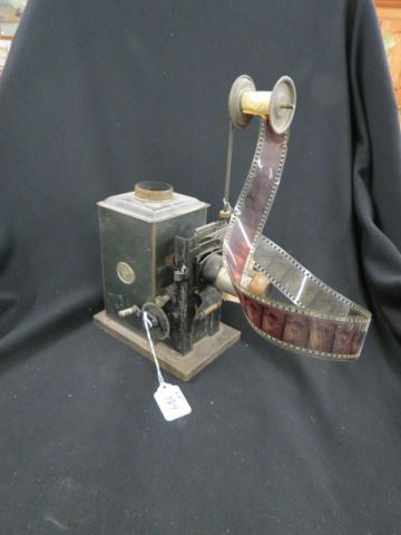 Appraisal: Early Tin Oil Lamp Style Movie Projector by E P