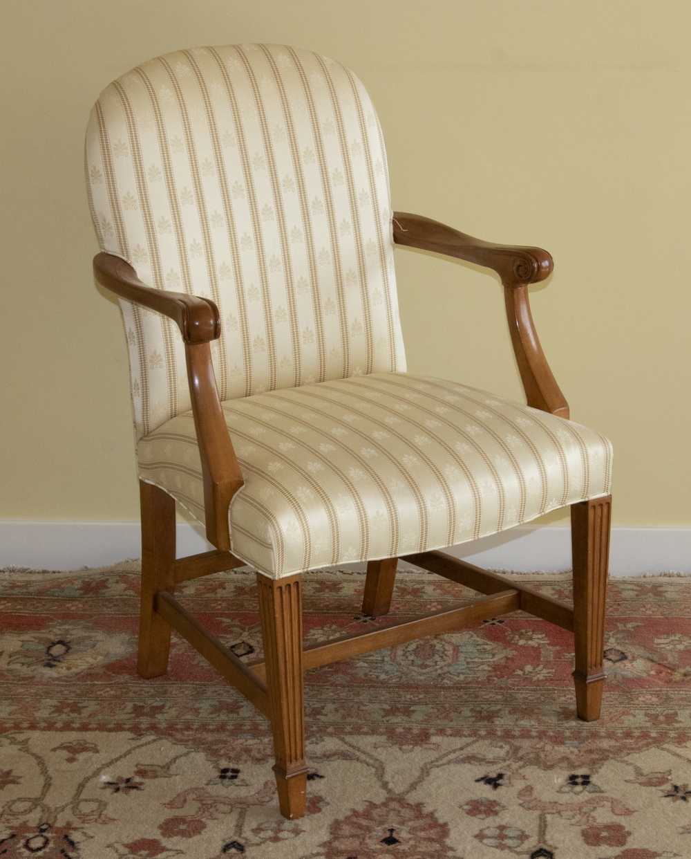 Appraisal: HEPPLEWHITE STYLE UPHOSLTERED ARM CHAIR An upholstered armchair made by