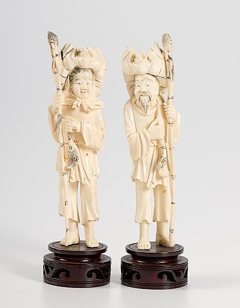 Appraisal: CHINESE CARVED IVORY FIGURINES PAIR Chinese early th century carved