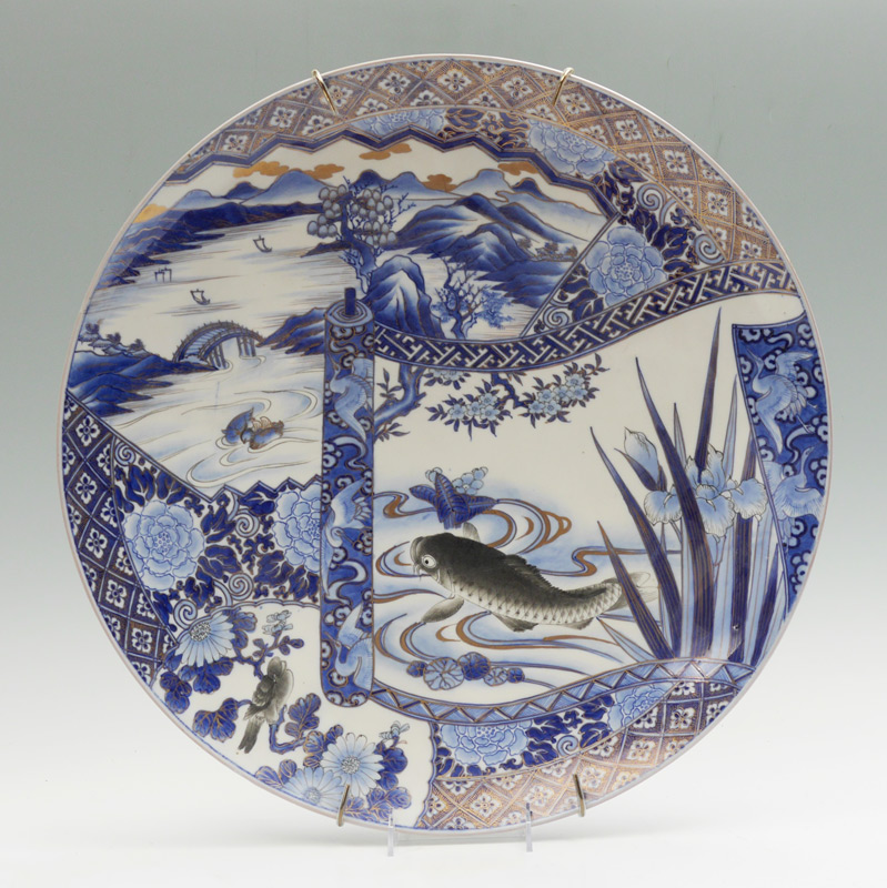 Appraisal: LARGE JAPANESE BLUE WHITE DECORATED CHARGER Decorated with vignettes of