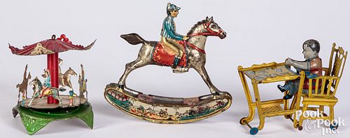 Appraisal: THREE PENNY TOYSThree penny toys to include horse jockey carousel