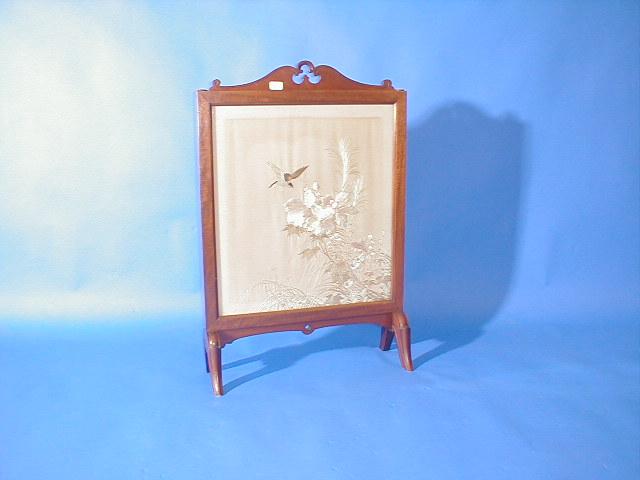 Appraisal: An early thC walnut framed fire screen with oriental needlework