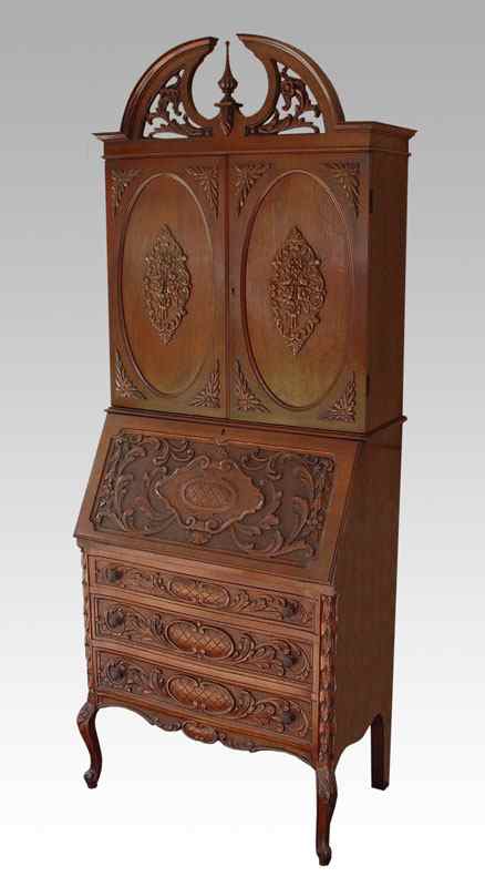 Appraisal: PROFUSELY CARVED WALNUT SECRETARY BOOKCASE Relief carved double doors bookcase