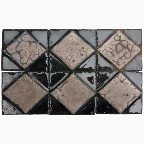 Appraisal: GRUEBY One hundred fourty-two geometric tiles with a raised diamond