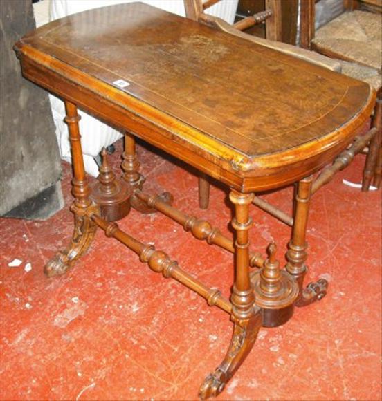 Appraisal: A Victorian walnut card table circa with green baize interior