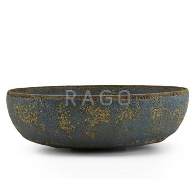 Appraisal: OTTO AND GERTRUD NATZLER Low bowl unusual dark blue-green volcanic