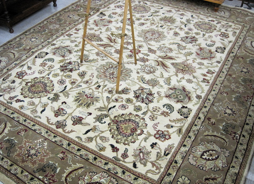 Appraisal: HAND KNOTTED ORIENTAL CARPET Indo-Persian overall floral decorated antique ivory