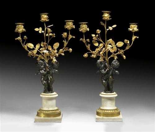 Appraisal: PAIR OF WHITE MARBLE AND GILT BROZE CANDELABRAS AUX AMOURS