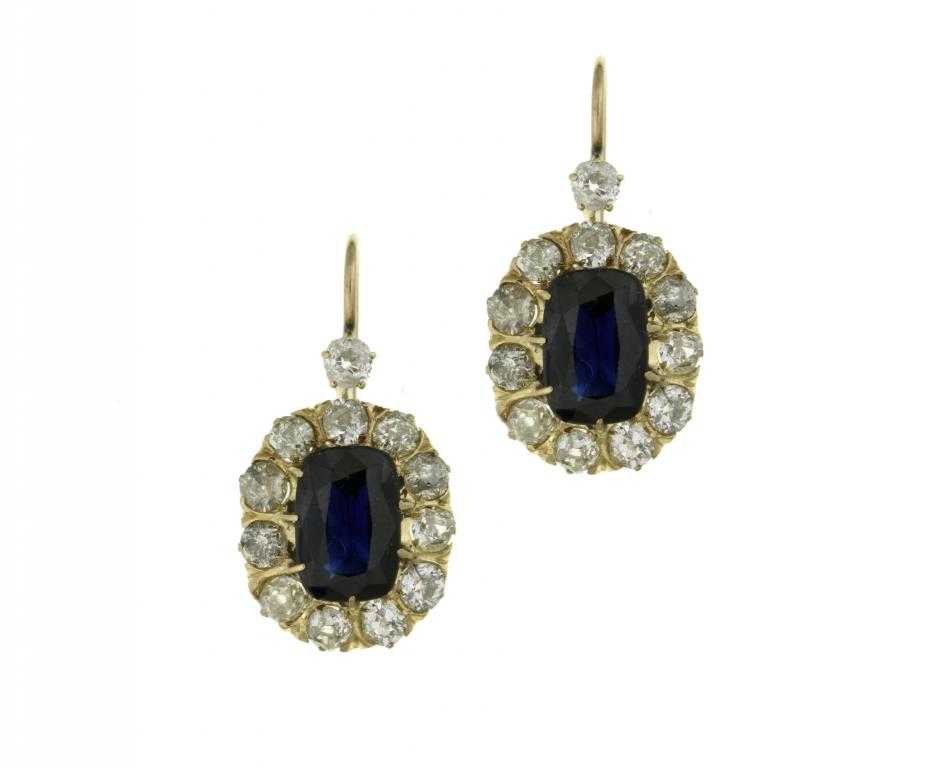 Appraisal: A PAIR OF SAPPHIRE AND DIAMOND EARRINGS of oblong cluster