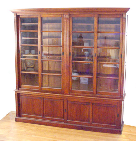 Appraisal: MASSIVE DOUBLE BOOKCASE In four parts Top has sliding glass