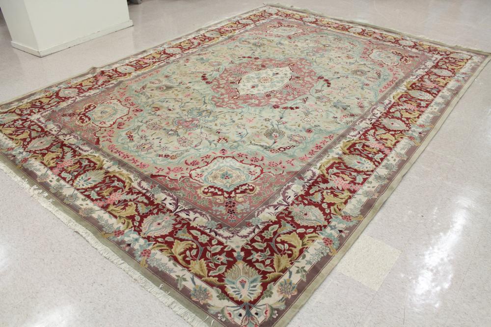 Appraisal: HAND KNOTTED ORIENTAL CARPET Persian floral and central floral medallion