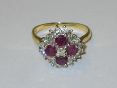 Appraisal: A RUBY AND DIAMOND CLUSTER RING comprising four round cut