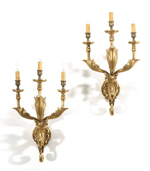 Appraisal: A pair of Neoclassical style giltwood three light bras de