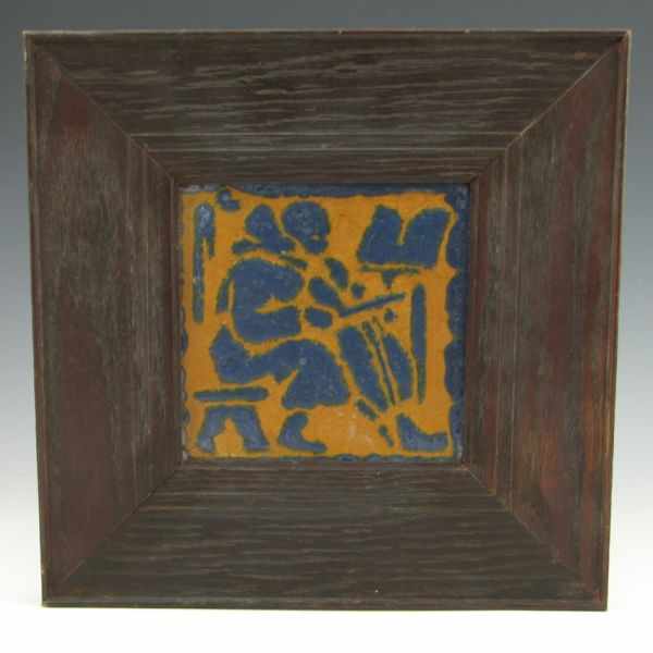 Appraisal: Grueby framed tile of a musician bass player in matte