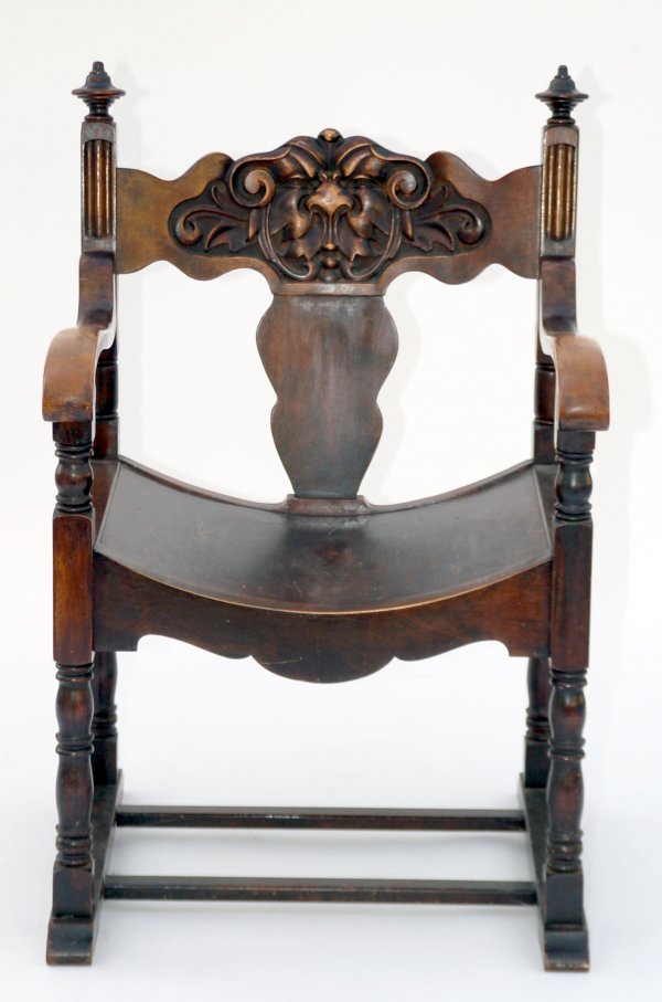 Appraisal: Mahogany chair Deeply carved back and turned finials c MEASUREMENTS