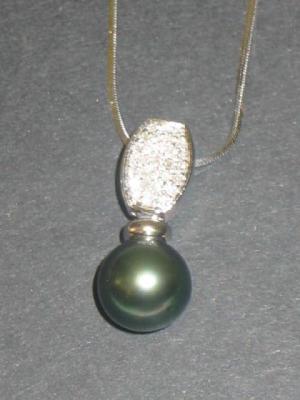 Appraisal: A BLACK PEARL AND DIAMOND PENDANT to match above on