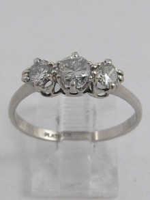 Appraisal: A white metal tests platinum three stone diamond ring the