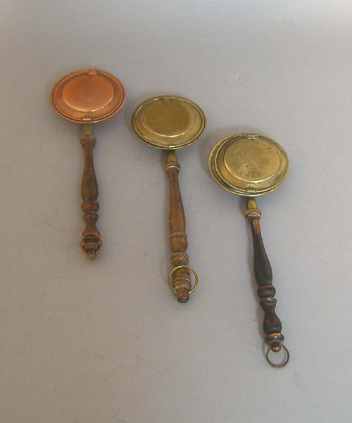 Appraisal: Three miniature brass and copper bedwarmers th c longest -