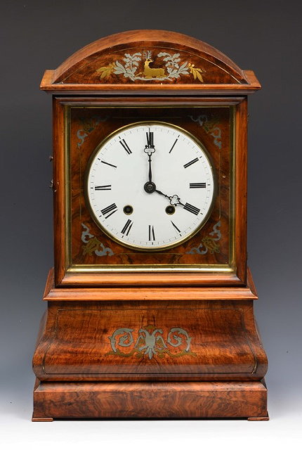 Appraisal: A BLACK FOREST MANTEL OR TABLE CLOCK with white enamel