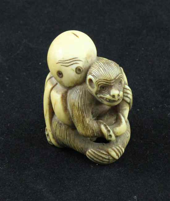 Appraisal: An Edo period ivory netsuke carved as an octopus grasping