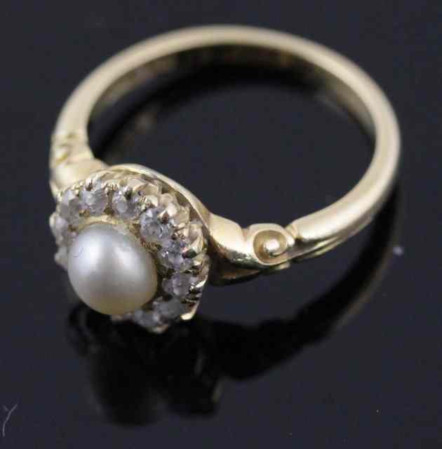 Appraisal: A diamond and pearl cluster ring set in ct gold