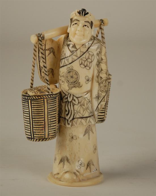 Appraisal: A Japanese Carved Bone Figure of a man carrying baskets