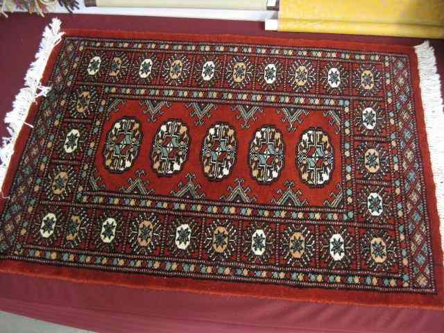 Appraisal: Bokara Handmade Mat geometrics on red field ' '' X