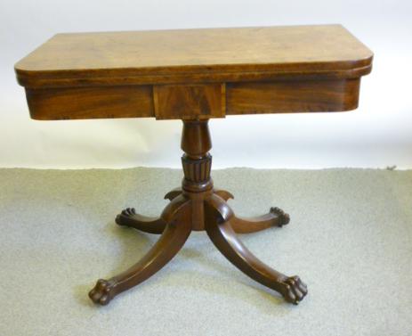 Appraisal: A MAHOGANY FOLDING TEA TABLE early th century the rounded