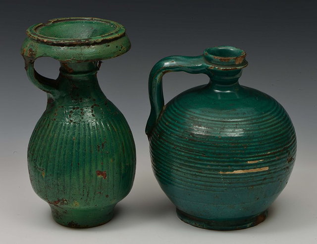 Appraisal: A PERSIAN GREEN POTTERY GLAZED EWER th Century cm and