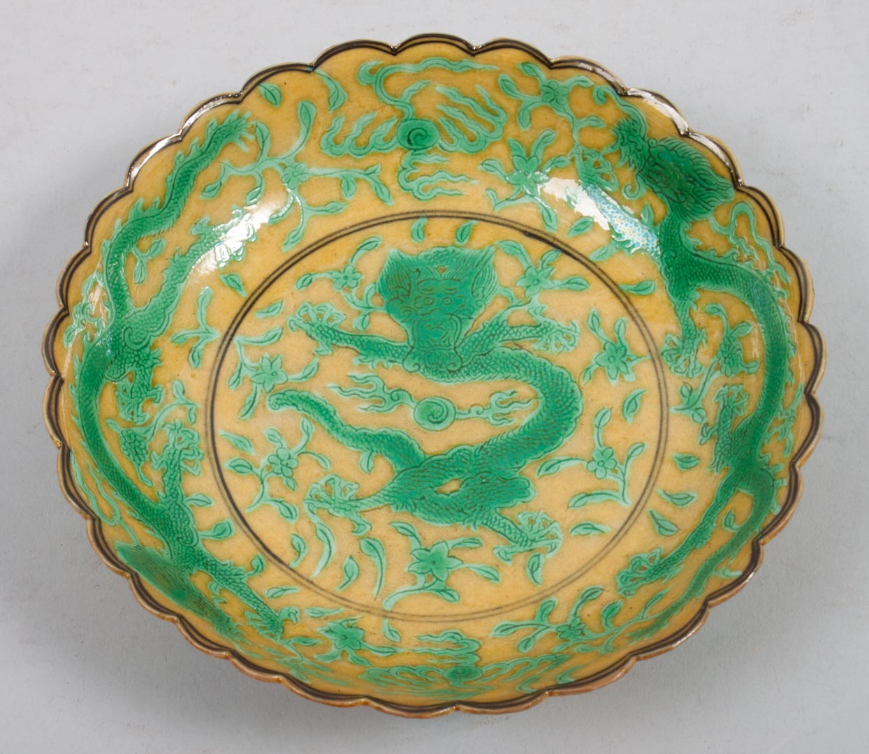 Appraisal: Chinese Famille Verte porcelain bowl yellow ground with green dragon