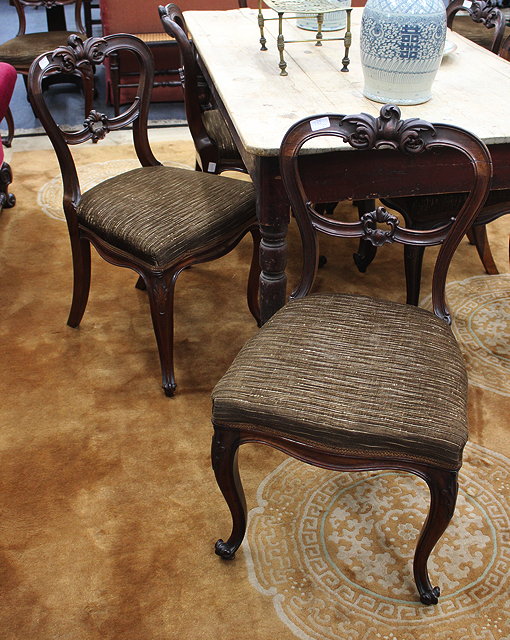 Appraisal: A SET OF EIGHT VICTORIAN ROSEWOOD DINING CHAIRS with shaped