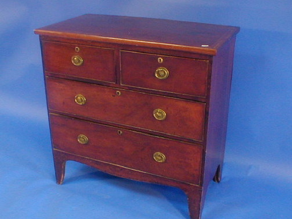 Appraisal: A George III cross banded mahogany chest of two short