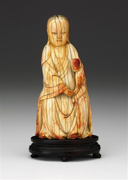 Appraisal: Fine Ivory Quanyin and child late ming The seated figure