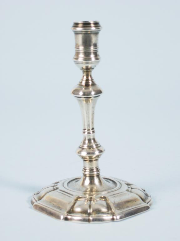 Appraisal: A George II Taperstick with knopped stem on shaped square